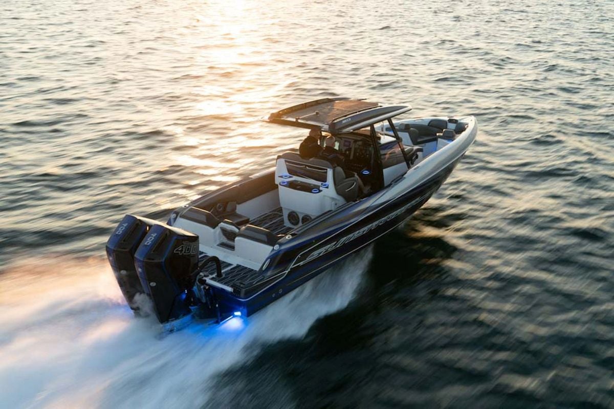 Boston Whaler boat on the water at sunset